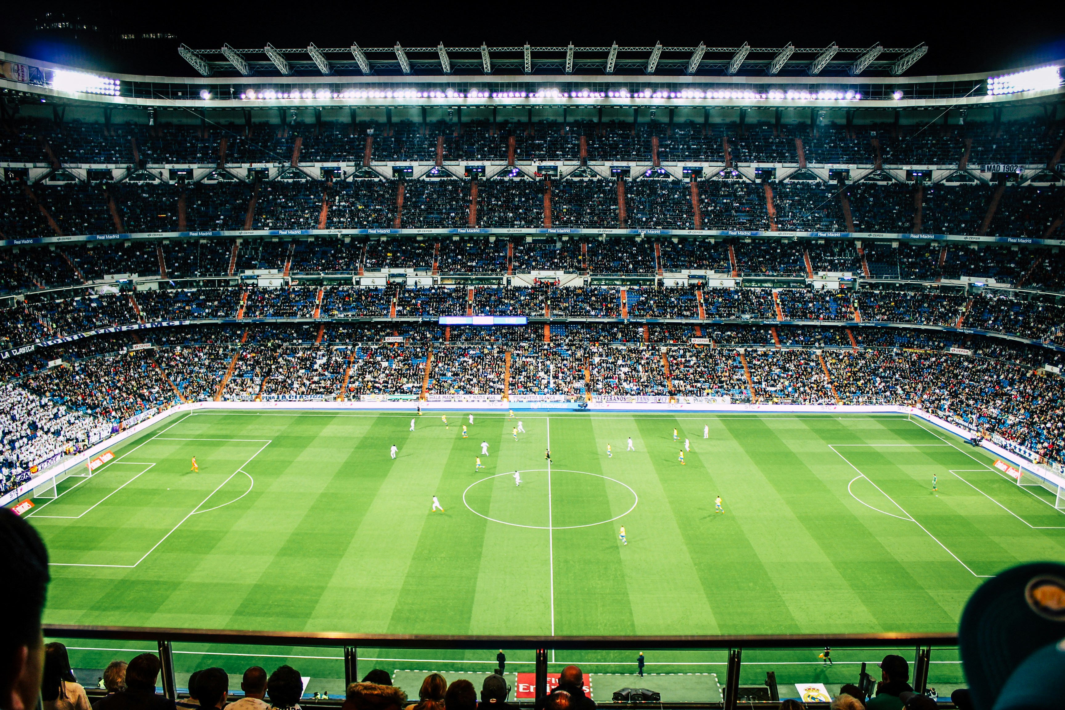 Football stadium with seating, floodlights and playing field